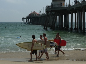 Surfers at Huntington Beach Pier